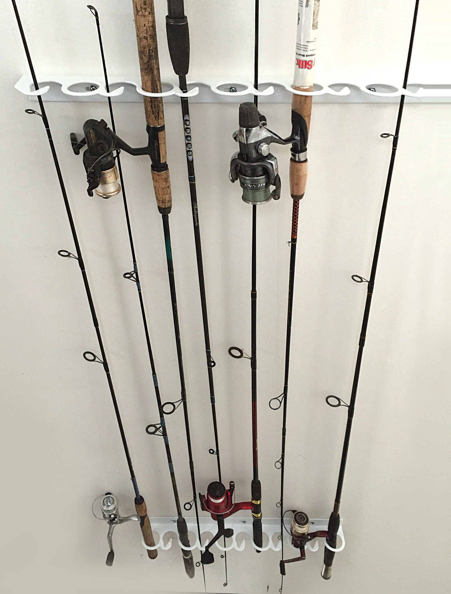 Ceiling mounted fishing pole rack. Instead of storing your fishing pol